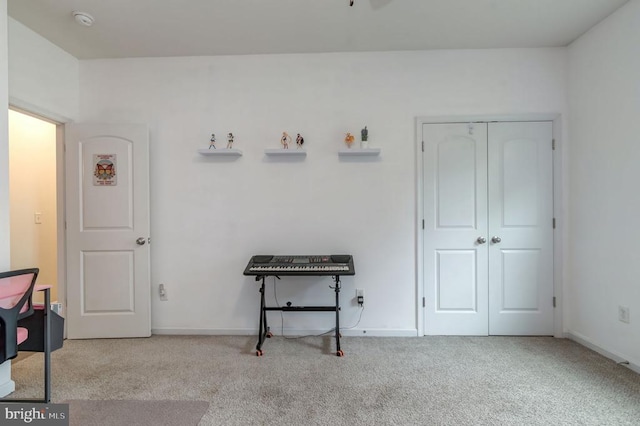  - misc room with carpet flooring and baseboards