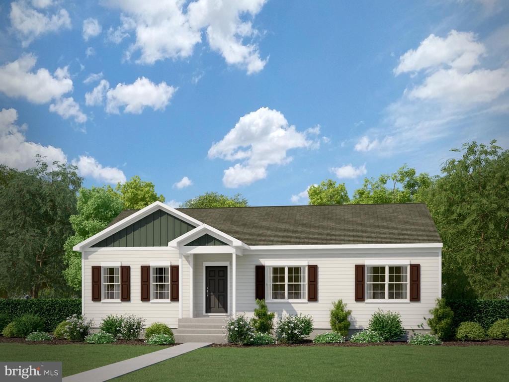 view of front of property with board and batten siding and a front yard