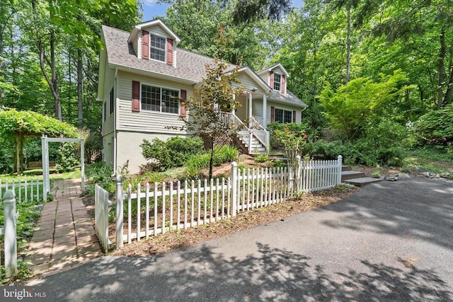 1215 Kinderhook Rd, Madison, VA 22727 - cape cod home featuring a shingled roof, stairway, and covered porch