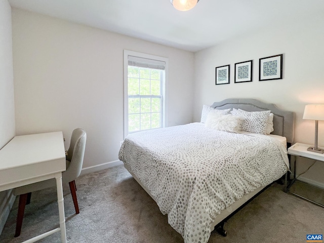 bedroom with carpet flooring and baseboards