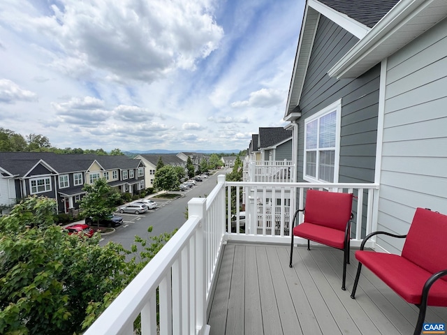 wooden terrace with a residential view