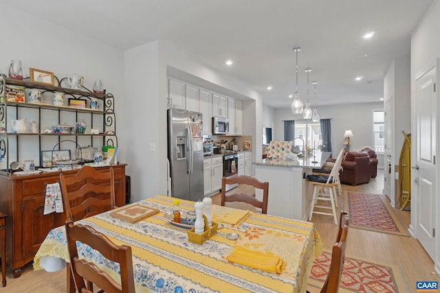 6031 Mccomb St, Crozet, VA 22932 - dining room with light wood finished floors and recessed lighting