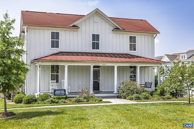 6031 Mccomb St, Crozet, VA 22932 - modern inspired farmhouse featuring covered porch, board and batten siding, a standing seam roof, a front lawn, and roof with shingles
