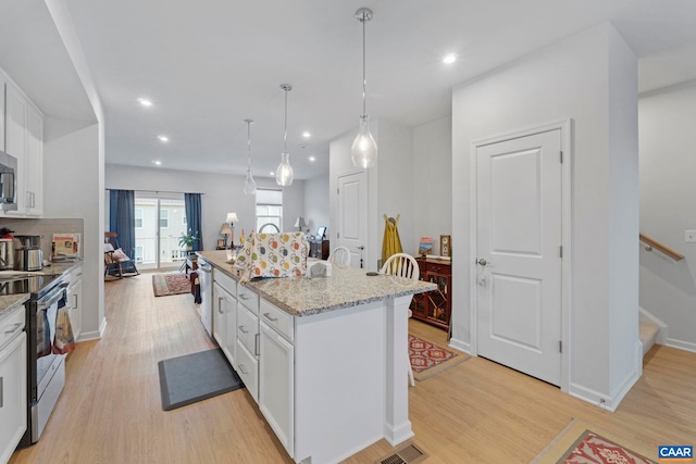 6031 Mccomb St, Crozet, VA 22932 - kitchen featuring stainless steel appliances, light wood-style flooring, white cabinets, and recessed lighting