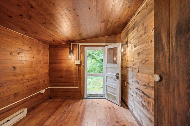 8196 Bow Bender Ln, Singers Glen, VA 22850 - entryway with a baseboard heating unit, wooden walls, lofted ceiling, wood ceiling, and hardwood / wood-style flooring