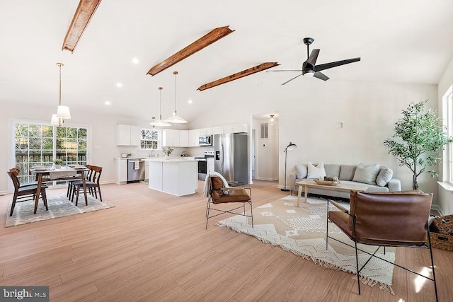 206 Seclusion Shores Dr, Mineral, VA 23117 - living room featuring beamed ceiling, light wood finished floors, ceiling fan, and high vaulted ceiling