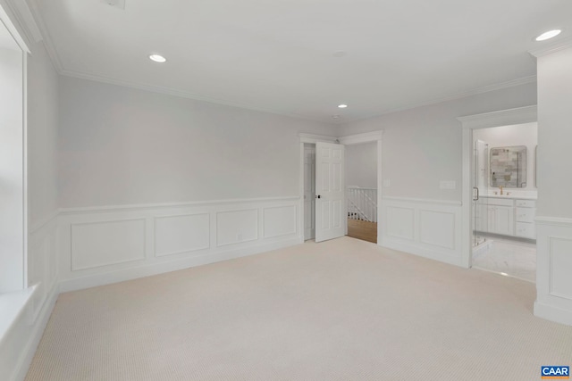 1108 E Jefferson St, Charlottesville, VA 22902 - unfurnished bedroom with carpet, crown molding, a wainscoted wall, recessed lighting, and ensuite bathroom