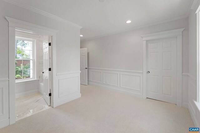 1108 E Jefferson St, Charlottesville, VA 22902 - empty room featuring wainscoting, recessed lighting, a decorative wall, crown molding, and carpet flooring