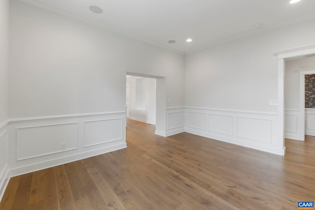 1108 E Jefferson St, Charlottesville, VA 22902 - unfurnished room featuring a decorative wall, recessed lighting, a wainscoted wall, wood finished floors, and ornamental molding
