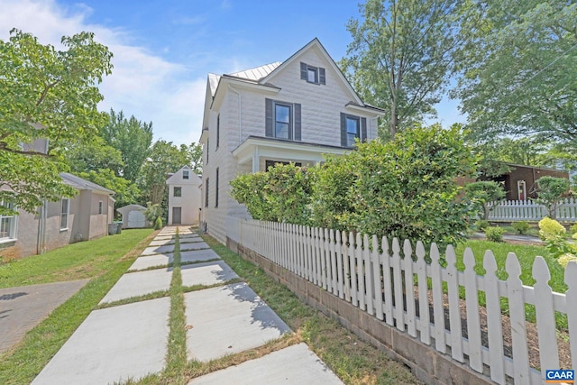 1108 E Jefferson St, Charlottesville, VA 22902 - view of front facade with a standing seam roof, a metal roof, and a shed