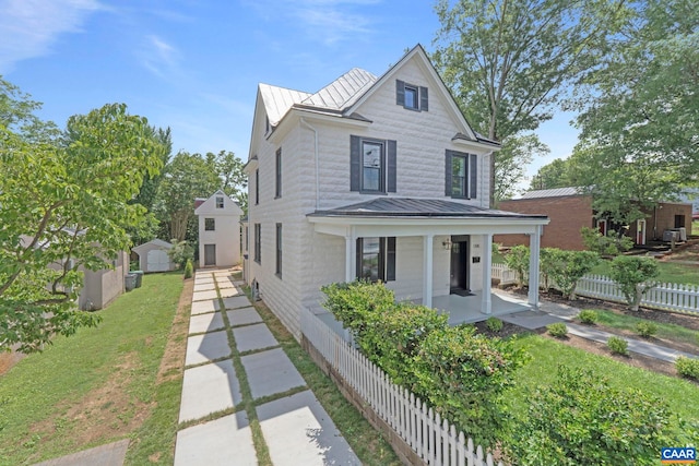 1108 E Jefferson St, Charlottesville, VA 22902 - view of front of property featuring a standing seam roof, a porch, a metal roof, and a shed