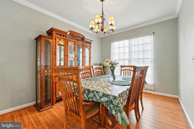 230 Whitworth Dr, Culpeper, VA 22701 - dining space with a chandelier, light wood finished floors, and ornamental molding