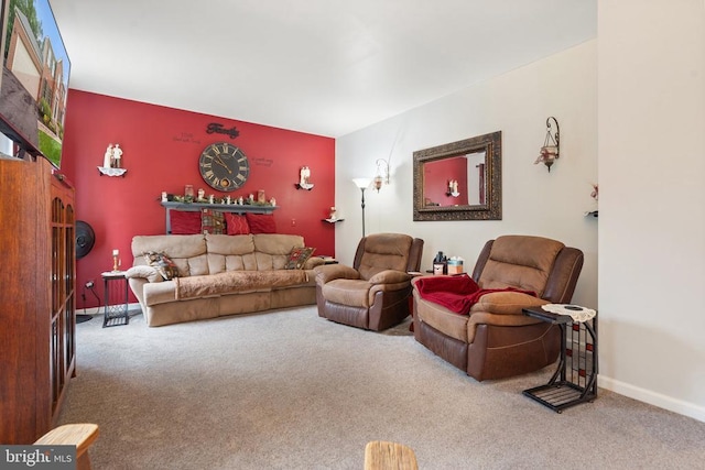  - living area with carpet and an accent wall