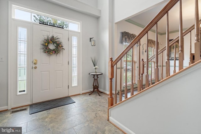  - foyer entrance with stairs and stone finish flooring
