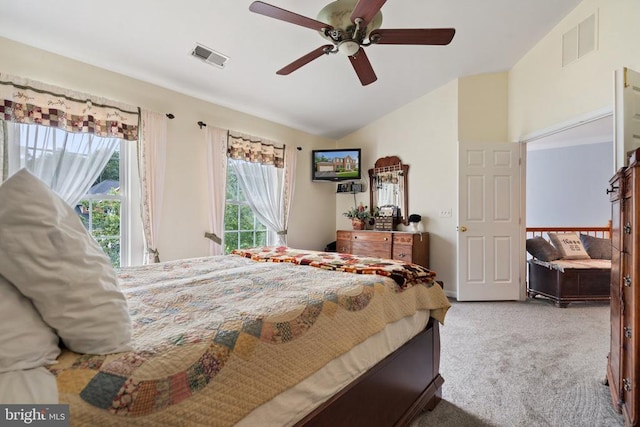  - bedroom featuring carpet floors, lofted ceiling, and a ceiling fan