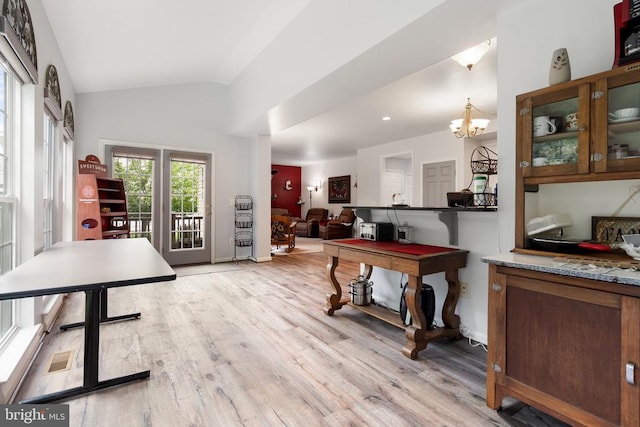  - playroom featuring light wood-style floors, vaulted ceiling, and a chandelier