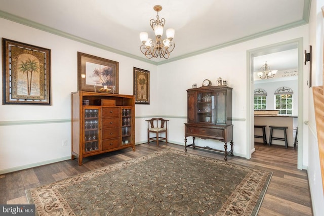  - sitting room with a chandelier, wood finished floors, and crown molding
