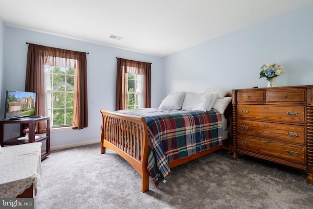  - carpeted bedroom featuring baseboards