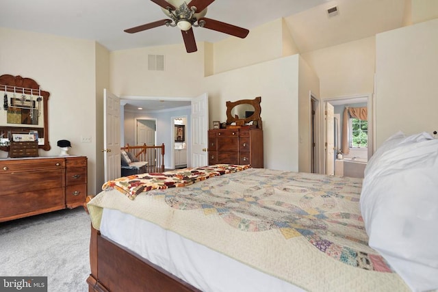  - bedroom with carpet, connected bathroom, lofted ceiling, and ceiling fan