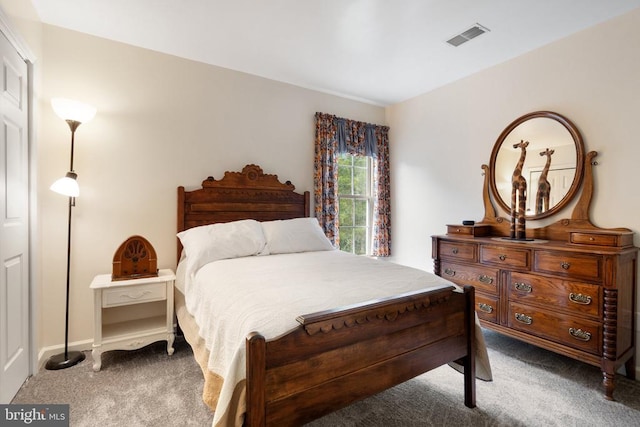  - bedroom featuring carpet and baseboards