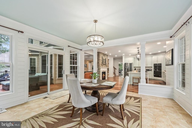 519 Cardinal Ln, Warrenton, VA 20186 - dining area with a chandelier, ornate columns, light tile patterned flooring, and recessed lighting