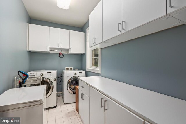519 Cardinal Ln, Warrenton, VA 20186 - laundry room featuring cabinet space, separate washer and dryer, and light tile patterned floors