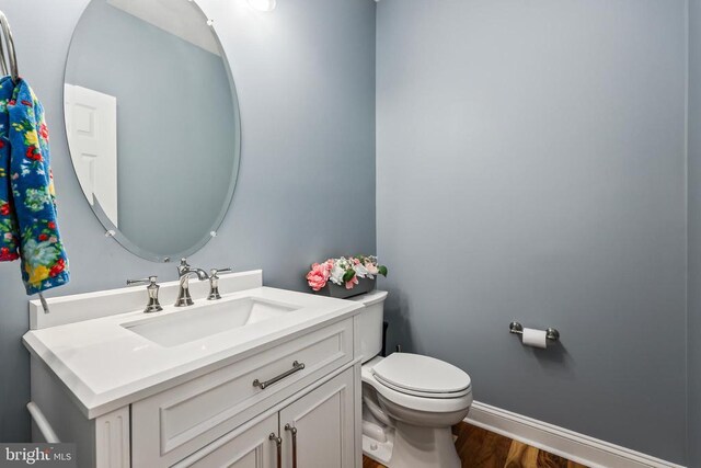 519 Cardinal Ln, Warrenton, VA 20186 - half bath with toilet, vanity, and wood finished floors