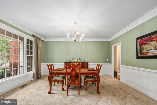 519 Cardinal Ln, Warrenton, VA 20186 - carpeted dining space with a chandelier, ornamental molding, healthy amount of natural light, and wainscoting