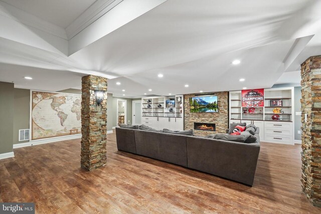 519 Cardinal Ln, Warrenton, VA 20186 - living room featuring ornate columns, a large fireplace, wood finished floors, recessed lighting, and ornamental molding