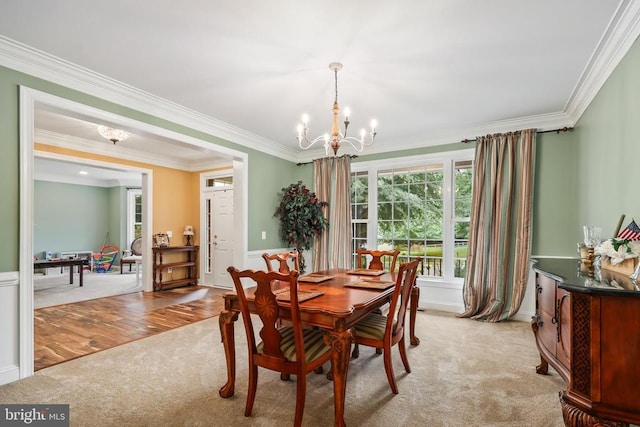 519 Cardinal Ln, Warrenton, VA 20186 - dining area with a chandelier, light carpet, crown molding, and wainscoting