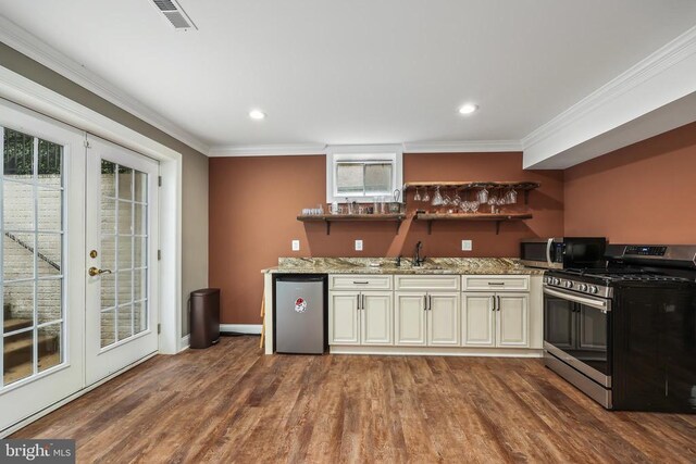519 Cardinal Ln, Warrenton, VA 20186 - kitchen featuring appliances with stainless steel finishes, cream cabinets, crown molding, french doors, and light stone counters