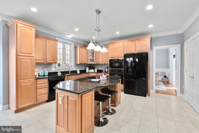 kitchen with black appliances, crown molding, a center island, a kitchen breakfast bar, and light brown cabinets