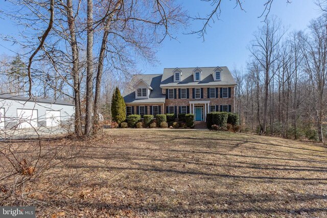 view of front of home featuring brick siding
