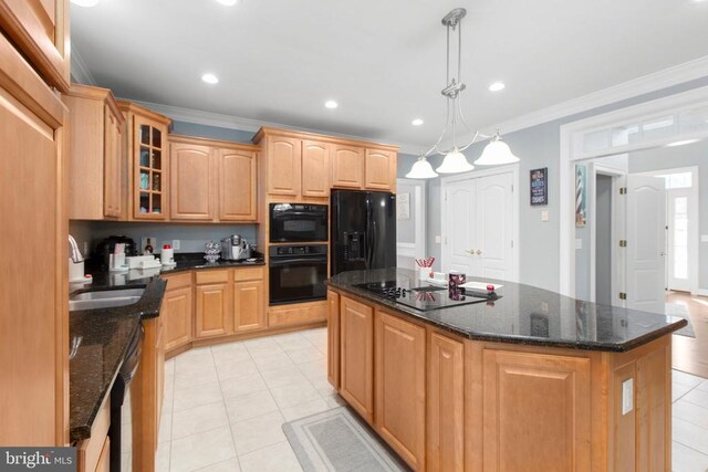 kitchen featuring black appliances, light tile patterned floors, a kitchen island, glass insert cabinets, and crown molding