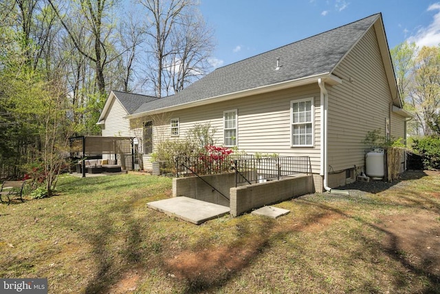 3704 Elk Creek Rd, Mineral, VA 23117 - back of house with a shingled roof and a lawn