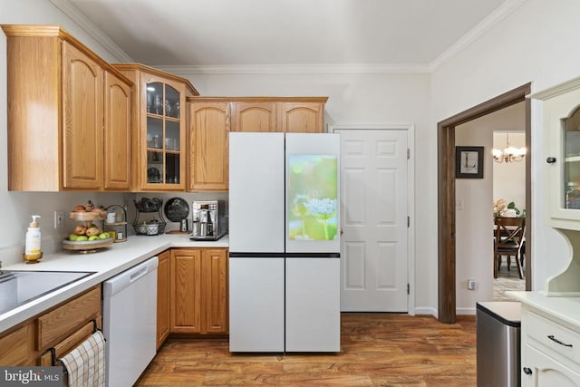 3704 Elk Creek Rd, Mineral, VA 23117 - kitchen featuring light countertops, glass insert cabinets, an inviting chandelier, and white appliances