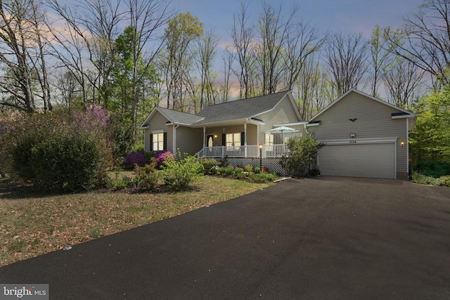 3704 Elk Creek Rd, Mineral, VA 23117 - ranch-style home featuring covered porch and aphalt driveway