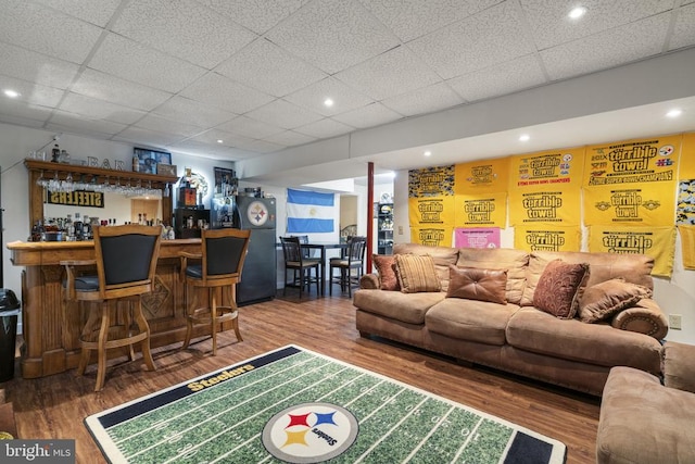 3704 Elk Creek Rd, Mineral, VA 23117 - living room featuring a drop ceiling, a bar, and wood finished floors