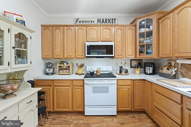 3704 Elk Creek Rd, Mineral, VA 23117 - kitchen with stainless steel microwave, crown molding, light countertops, and electric stove