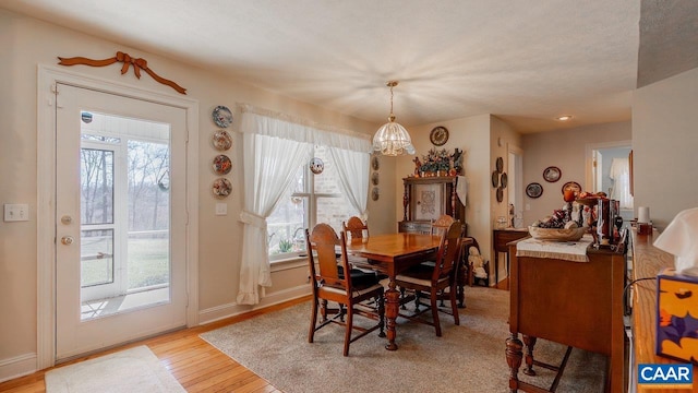 2273 Bloomer Springs Rd, Mcgaheysville, VA 22840 - dining room featuring baseboards, light wood finished floors, a healthy amount of sunlight, and a chandelier