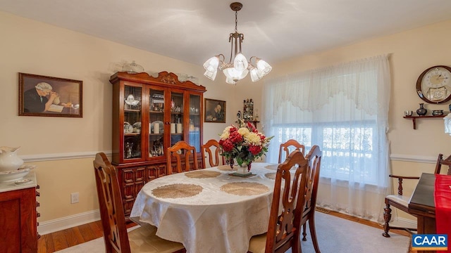 2273 Bloomer Springs Rd, Mcgaheysville, VA 22840 - dining area with an inviting chandelier, baseboards, and wood finished floors