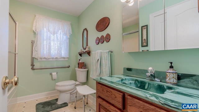 2273 Bloomer Springs Rd, Mcgaheysville, VA 22840 - bathroom with toilet, baseboards, and vanity