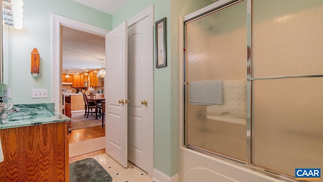 2273 Bloomer Springs Rd, Mcgaheysville, VA 22840 - bathroom with baseboards, vanity, combined bath / shower with glass door, and wood finished floors