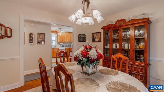 2273 Bloomer Springs Rd, Mcgaheysville, VA 22840 - dining space with a chandelier, baseboards, and light wood-type flooring