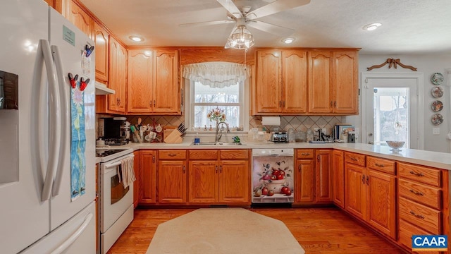 2273 Bloomer Springs Rd, Mcgaheysville, VA 22840 - kitchen featuring a sink, decorative backsplash, white appliances, and light countertops