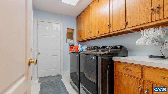 2273 Bloomer Springs Rd, Mcgaheysville, VA 22840 - laundry room with cabinet space, washer and clothes dryer, and light tile patterned flooring