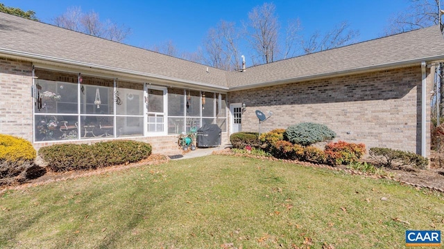 2273 Bloomer Springs Rd, Mcgaheysville, VA 22840 - rear view of house featuring a lawn, roof with shingles, brick siding, and a sunroom