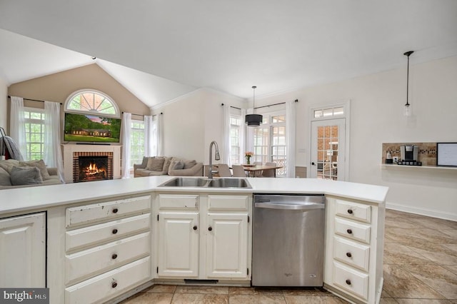 8504 Matthew Maury Ct, Spotsylvania, VA 22553 - kitchen with a sink, dishwasher, open floor plan, a brick fireplace, and vaulted ceiling