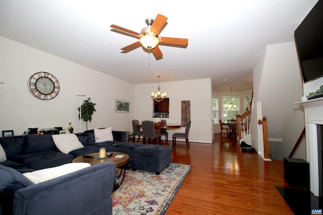 106 Melbourne Prk Cir Unit E, Charlottesville, VA 22901 - living area featuring a chandelier, wood finished floors, a ceiling fan, and stairway