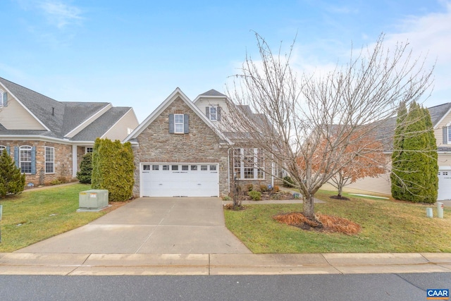 view of front of house with a garage and a front yard